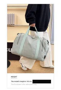 Detail shot of lightweight nylon travel bag with spacious side zipper pocket for storage