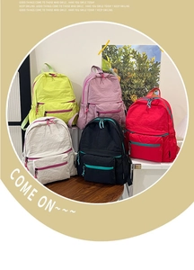 Detailed display of five colorful nylon backpacks in various trendy and vibrant shades