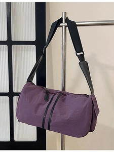 Purple nylon yoga travel bag with black adjustable shoulder strap for women