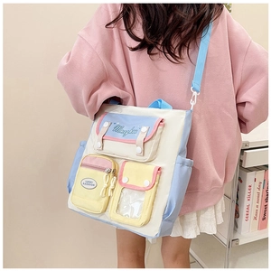 Detailed back view of a multi-pocket canvas crossbody bag with contrast macaron colors