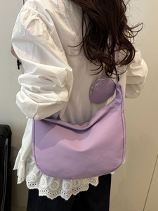 Minimalist lavender nylon half-moon crossbody bag with matching round coin pouch