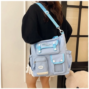 Detail of light blue waterproof nylon messenger bag with multiple pockets and adjustable strap