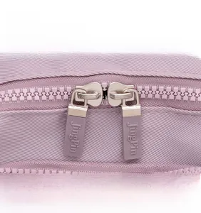 Detailed close-up of pink nylon backpack double metal zippers with JingPin branding