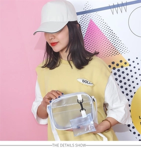 Detailed view of clear PVC jelly crossbody bag with inner pouch and white shoulder strap