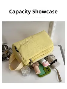 Macro view showing large capacity storage of this yellow nylon crossbody organizer bag