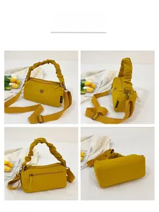 Detailed views of yellow nylon handbag with ruffled handle and clover metal hardware