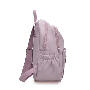 Minimalist lavender nylon backpack for women featuring multiple compartments and side pockets