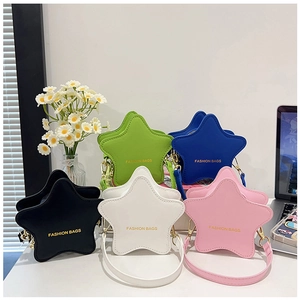 Detail shot of star-shaped crossbody bags in black, white, pink, green and blue colors