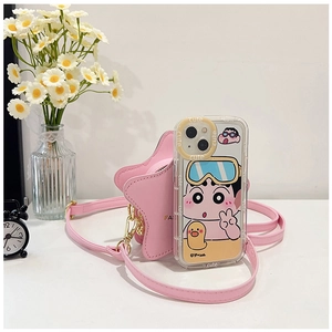 Pink star-shaped crossbody bag and cartoon character phone case set on white table