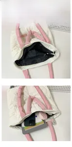 Detailed view of the large capacity quilted tote bag with internal zipper pocket layout