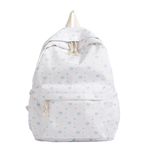 White canvas backpack with blue star heart patterns and spacious front zipper pocket