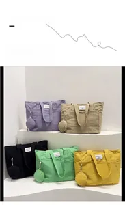 Detailed display of large capacity tote bags in five colors with matching small pouches