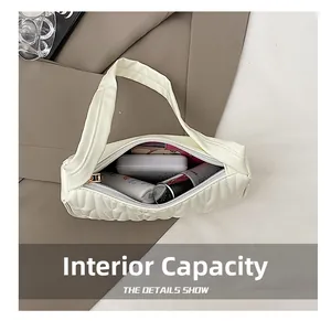 Detail view of the spacious internal capacity and smooth zipper closure of the white bag