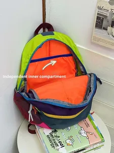 Detail view of water-resistant multi-color backpack with orange inner divider