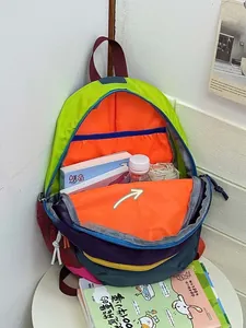 Detail view of colorful backpack interior showing large capacity and multi-compartment storage