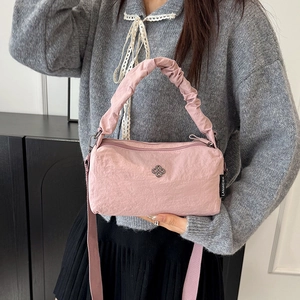 Pink quilted nylon handbag with adjustable strap and clover buckle detail for women