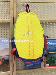 Detail view of breathable honeycomb mesh back and padded shoulder straps on backpack