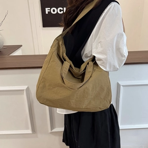 Minimalist khaki nylon tote bag with pleated texture for casual daily commuting use