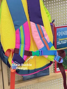 Detail of colorful backpack straps with breathable mesh and green chest buckle design
