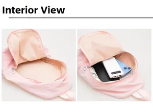 Vue intérieure d'un sac à dos rose montrant l'espace pour batterie et smartphone