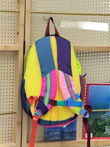 Detail view of the breathable yellow mesh back panel and colorful adjustable straps