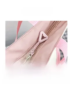 Close-up of durable zipper closure on a pink minimalist backpack with stylish puller