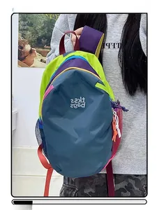 Detail view of water-resistant multicolor backpack with mesh pockets and contrast zippers