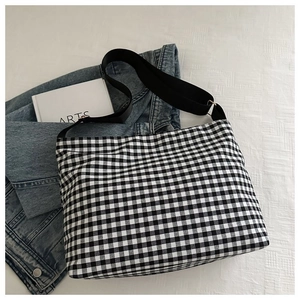 Classic black and white gingham canvas tote bag with adjustable wide strap and metal buckle