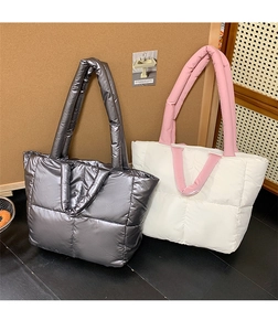 Quilted puffer tote bags in metallic grey and white with wide stitched padding detail