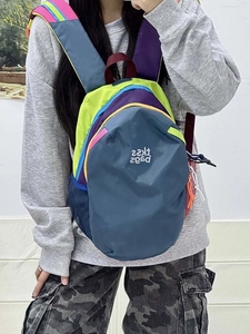 Detail view of colorful waterproof nylon backpack with side mesh pocket and cord zippers