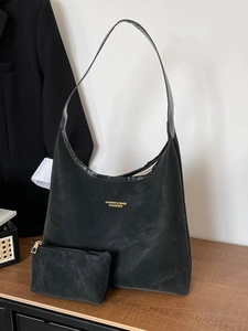 Black suede tote bag with small purse and gold lettering for women's daily commute