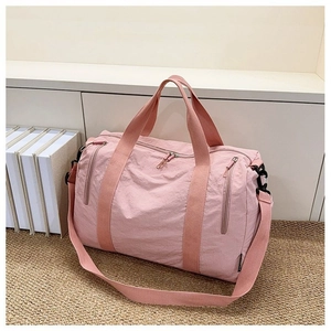 Pink nylon travel gym bag with large capacity, dual handles and adjustable shoulder strap