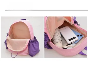 Detailansicht des geräumigen Stauraums und der Fächer im rosa-violetten Rucksack