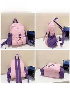 Detaillierte Mehrwinkelansicht eines pink-violetten Nylon-Rucksacks mit Kordelzug-Seitentaschen