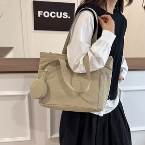 Lightweight nylon tote bag in beige with matching small coin pouch and shoulder straps