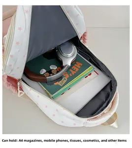 Spacious interior of starry cat school bag showing A4 magazine and tablet storage