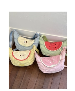 Detail of colorful fruit crossbody bags with zippers and cute embroidery motifs