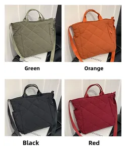 Quilted tote bags in four colors with adjustable shoulder straps and side pockets