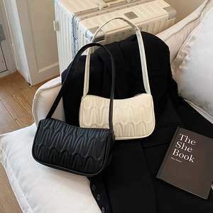 French style wavy quilted baguette bag in black and cream white faux leather
