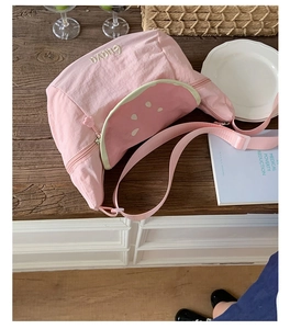 Pink nylon crossbody bag with watermelon patch and cute cat paw zipper detail