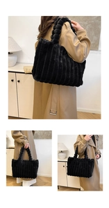 Detail view of black faux fur tote bag with vertical stripes and fluffy pom-pom handles