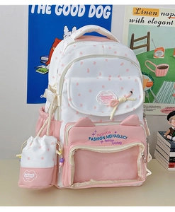 Detail of pink and white school backpack set with transparent window and star pattern
