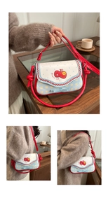 Detail of red and blue checkered flap bag with ruffles and 3D bow decoration