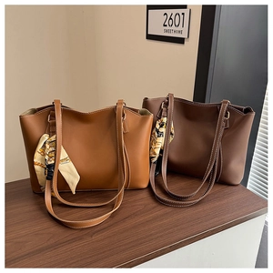 Detailed comparison of large brown and dark coffee tote bags with decorative silk scarves
