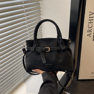 Retro black faux suede tote bag with decorative gold buckle and adjustable shoulder strap