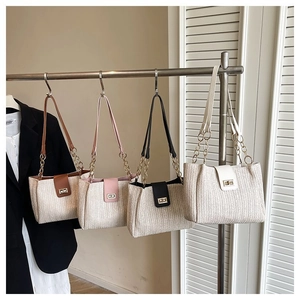 Woven straw tote bag with chain strap in four colors for summer beach vacations