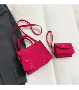 Detail of rose red quilted felt handbag set including tote and matching pouches