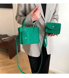 Detailed view of 3-piece green quilted felt bag set with main handbag and coin purse