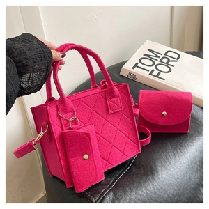 Detail view of pink quilted felt 3-piece bag set with tote, chain pouch and wallet