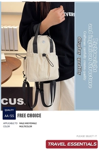 Detail of a beige lightweight nylon backpack with functional drawstring and side loop